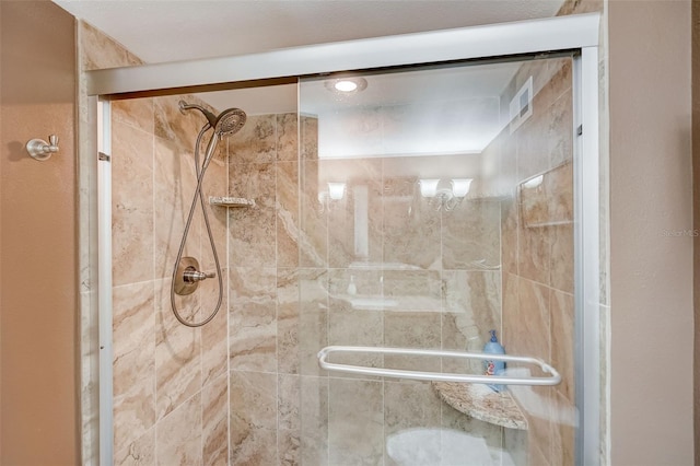 2425 Gulf Of Mexico Dr Unit 14B, Longboat Key, FL 34228 - full bathroom with a shower stall