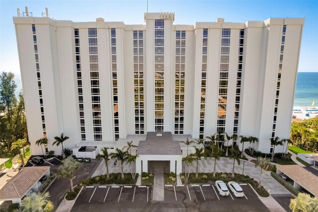 2425 Gulf Of Mexico Dr Unit 14B, Longboat Key, FL 34228 - view of building exterior with a water view and uncovered parking