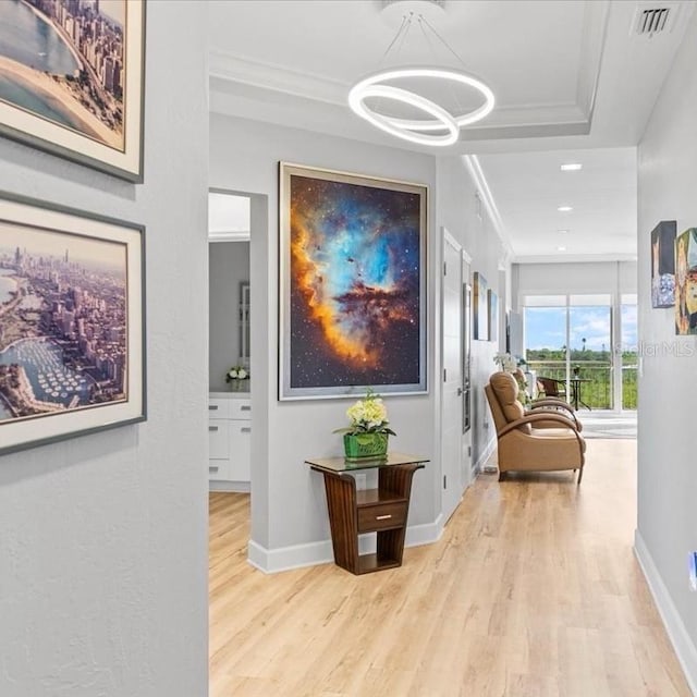 5450 Eagles Point Cir Unit 404, Sarasota, FL 34231 - hall with wood finished floors, a chandelier, baseboards, crown molding, and recessed lighting