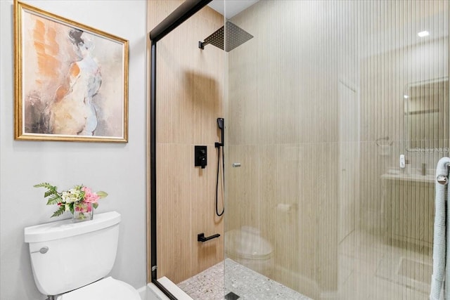 5450 Eagles Point Cir Unit 404, Sarasota, FL 34231 - bathroom featuring toilet and a stall shower