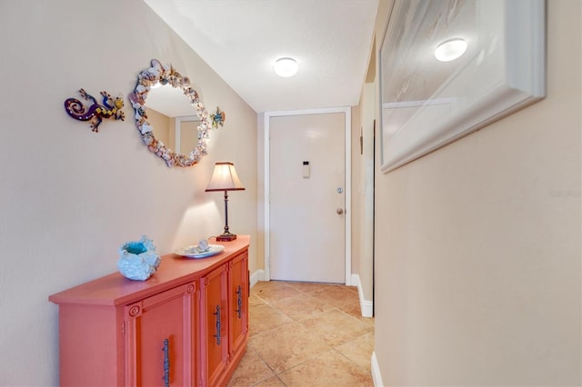 3806 Gulf Of Mexico Dr Unit C204, Longboat Key, FL 34228 - hall with light tile patterned floors and baseboards