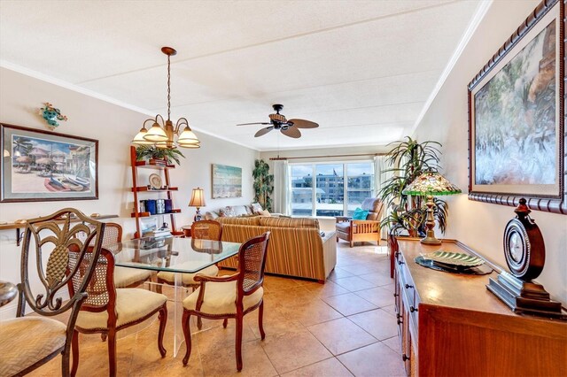 3806 Gulf Of Mexico Dr Unit C204, Longboat Key, FL 34228 - dining room with crown molding, a ceiling fan, and light tile patterned flooring