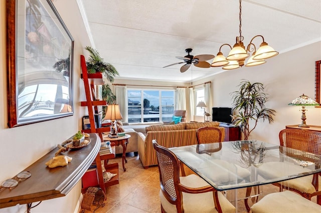 3806 Gulf Of Mexico Dr Unit C204, Longboat Key, FL 34228 - dining room featuring a ceiling fan, a chandelier, crown molding, and light tile patterned flooring