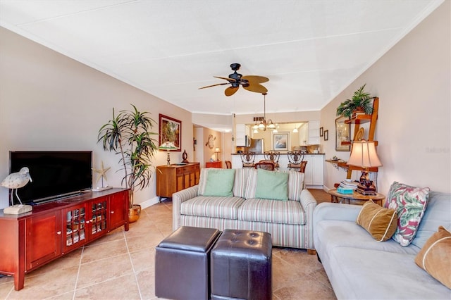 3806 Gulf Of Mexico Dr Unit C204, Longboat Key, FL 34228 - living area featuring a ceiling fan, a chandelier, light tile patterned floors, crown molding, and baseboards