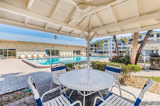 3806 Gulf Of Mexico Dr Unit C204, Longboat Key, FL 34228 - community pool with a patio, grilling area, and ceiling fan