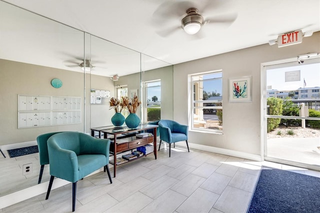 3806 Gulf Of Mexico Dr Unit C204, Longboat Key, FL 34228 - sitting room featuring mail area, ceiling fan, and baseboards