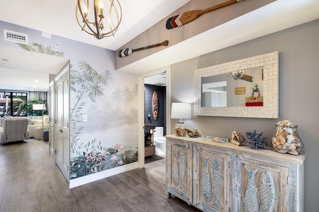 1445 Gulf Of Mexico Dr Unit 203, Longboat Key, FL 34228 - corridor with a chandelier, lofted ceiling, and wood finished floors