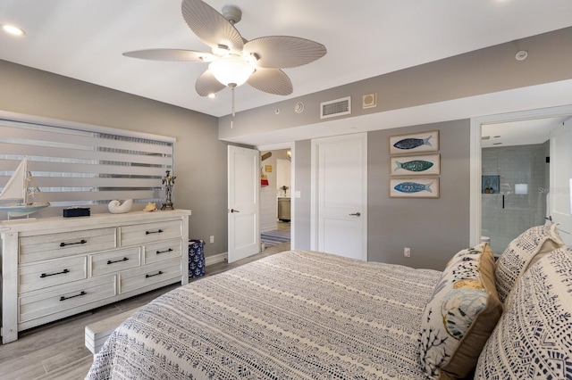 1445 Gulf Of Mexico Dr Unit 203, Longboat Key, FL 34228 - bedroom featuring light wood-type flooring, recessed lighting, ceiling fan, and connected bathroom