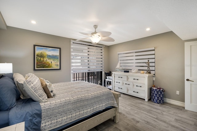 1445 Gulf Of Mexico Dr Unit 203, Longboat Key, FL 34228 - bedroom with light wood-style floors, recessed lighting, and a ceiling fan