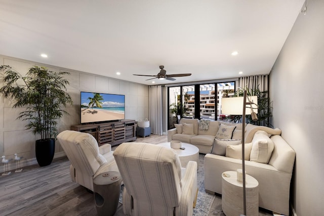 1445 Gulf Of Mexico Dr Unit 203, Longboat Key, FL 34228 - living room featuring wood finished floors, a ceiling fan, and recessed lighting