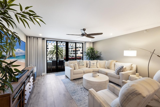 1445 Gulf Of Mexico Dr Unit 203, Longboat Key, FL 34228 - living area featuring wood finished floors, ceiling fan, and recessed lighting