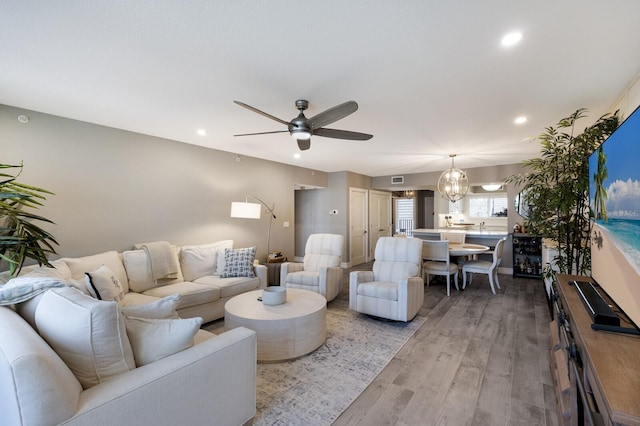 1445 Gulf Of Mexico Dr Unit 203, Longboat Key, FL 34228 - living room featuring a ceiling fan, light wood finished floors, and recessed lighting