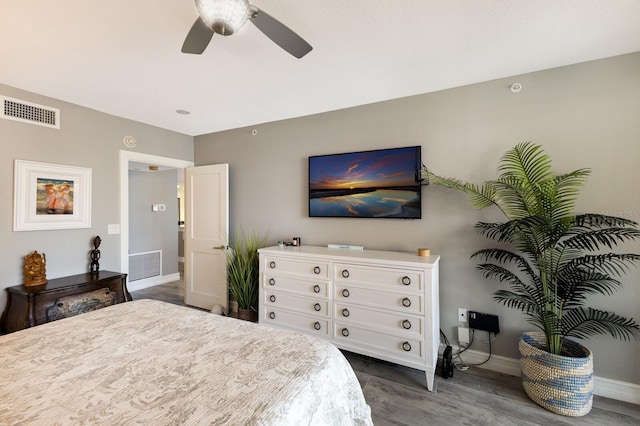 1445 Gulf Of Mexico Dr Unit 203, Longboat Key, FL 34228 - bedroom with dark wood finished floors and a ceiling fan