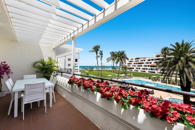 1445 Gulf Of Mexico Dr Unit 203, Longboat Key, FL 34228 - balcony featuring a pergola, a water view, view of pool area, and outdoor dining area