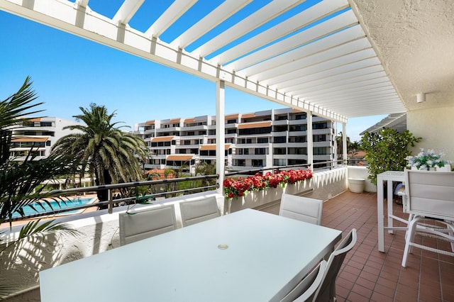 1445 Gulf Of Mexico Dr Unit 203, Longboat Key, FL 34228 - patio / terrace featuring a pergola and outdoor dining space