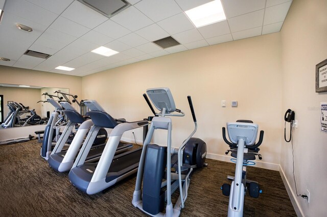 1445 Gulf Of Mexico Dr Unit 203, Longboat Key, FL 34228 - exercise room featuring carpet floors and a drop ceiling