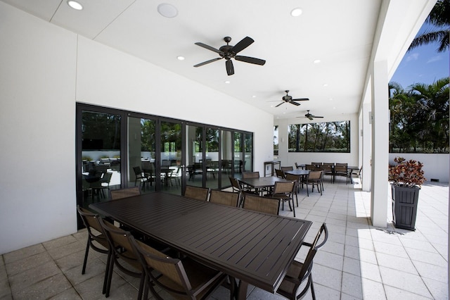 1445 Gulf Of Mexico Dr Unit 203, Longboat Key, FL 34228 - view of patio featuring outdoor dining area and ceiling fan