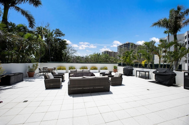 1445 Gulf Of Mexico Dr Unit 203, Longboat Key, FL 34228 - view of patio / terrace featuring area for grilling and outdoor lounge area