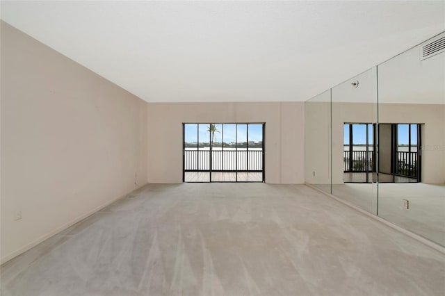 3630 Gulf Of Mexico Dr Unit 202, Longboat Key, FL 34228 - carpeted spare room with a water view