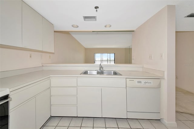 3630 Gulf Of Mexico Dr Unit 202, Longboat Key, FL 34228 - kitchen featuring white dishwasher, a sink, light countertops, light tile patterned floors, and stove