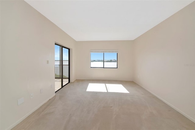3630 Gulf Of Mexico Dr Unit 202, Longboat Key, FL 34228 - unfurnished room featuring light carpet and baseboards