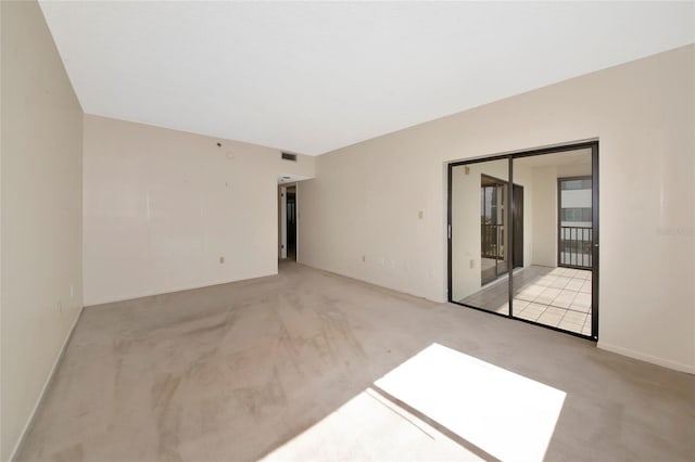 3630 Gulf Of Mexico Dr Unit 202, Longboat Key, FL 34228 - empty room with light colored carpet and baseboards