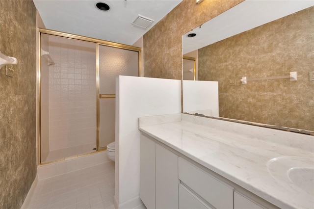 3630 Gulf Of Mexico Dr Unit 202, Longboat Key, FL 34228 - full bathroom with toilet, a stall shower, tile patterned flooring, and vanity