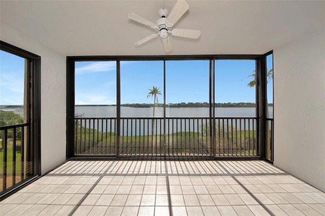3630 Gulf Of Mexico Dr Unit 202, Longboat Key, FL 34228 - unfurnished sunroom featuring a water view and plenty of natural light