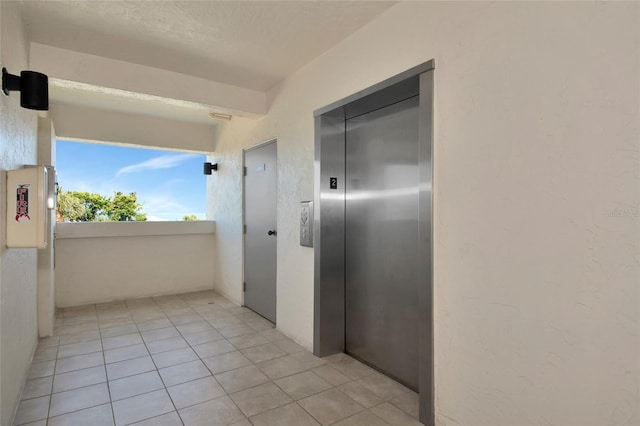 3630 Gulf Of Mexico Dr Unit 202, Longboat Key, FL 34228 - hall featuring elevator and light tile patterned flooring