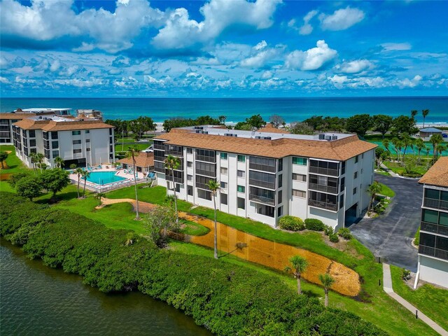 3630 Gulf Of Mexico Dr Unit 202, Longboat Key, FL 34228 - bird's eye view of a nearby body of water, a pool area, and apartment complex