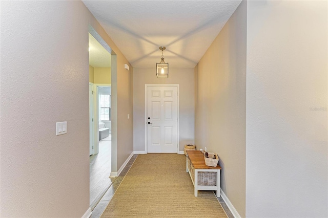 7410 61st St E, Palmetto, FL 34221 - doorway with light colored carpet and a textured wall