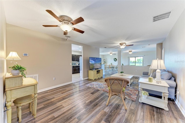 7410 61st St E, Palmetto, FL 34221 - living area featuring ceiling fan and wood finished floors