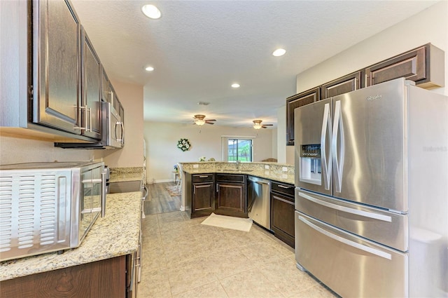 7410 61st St E, Palmetto, FL 34221 - kitchen featuring stainless steel appliances, recessed lighting, dark brown cabinets, a peninsula, and ceiling fan