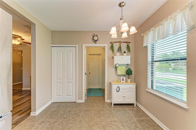 7410 61st St E, Palmetto, FL 34221 - dining space with a chandelier, light tile patterned floors, and ceiling fan