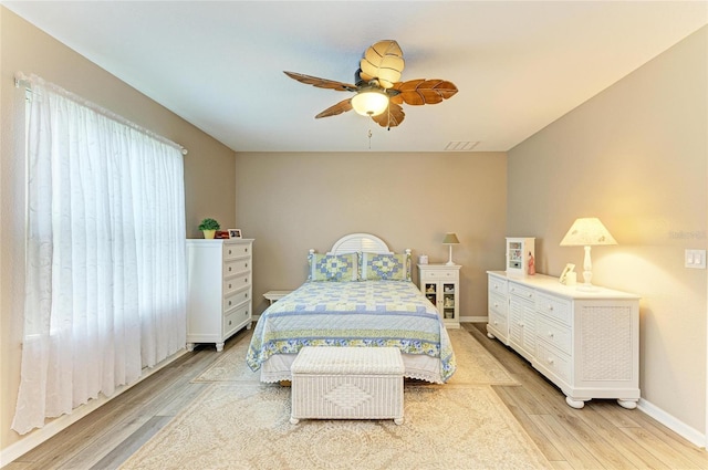 7410 61st St E, Palmetto, FL 34221 - bedroom with light wood-style floors and ceiling fan