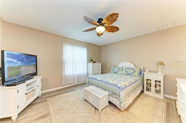 7410 61st St E, Palmetto, FL 34221 - bedroom with light wood-style floors and a ceiling fan