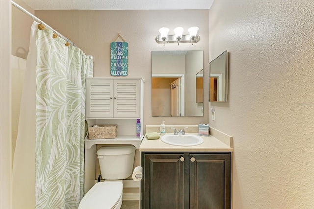 7410 61st St E, Palmetto, FL 34221 - bathroom with vanity, a textured wall, and a shower with shower curtain