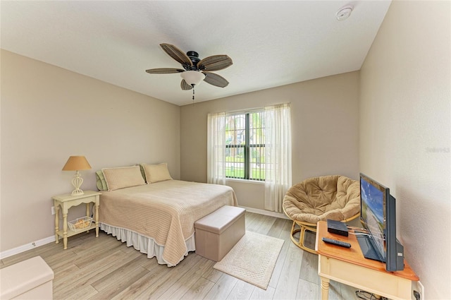 7410 61st St E, Palmetto, FL 34221 - bedroom with light wood-style flooring and a ceiling fan