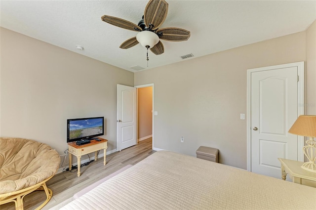 7410 61st St E, Palmetto, FL 34221 - bedroom with light wood-style flooring and ceiling fan
