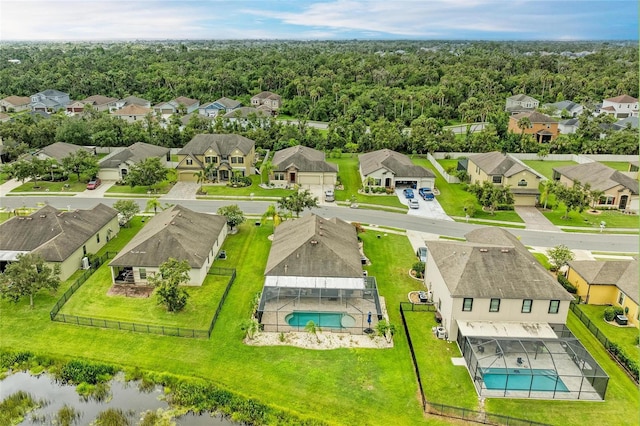 7410 61st St E, Palmetto, FL 34221 - aerial view of residential area featuring a pool and a heavily wooded area