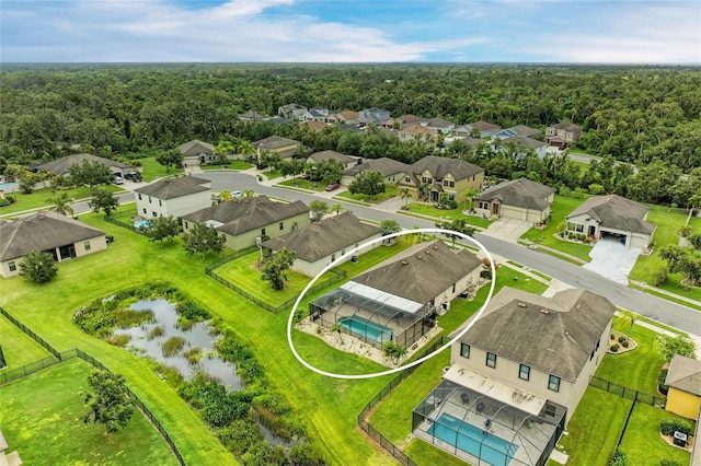 7410 61st St E, Palmetto, FL 34221 - aerial perspective of suburban area with a forest and a large body of water
