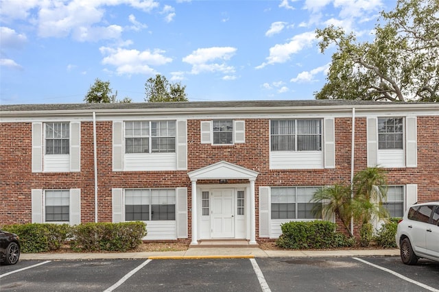 4507 9th St W Unit A2, Bradenton, FL 34207 - view of property featuring uncovered parking and brick siding