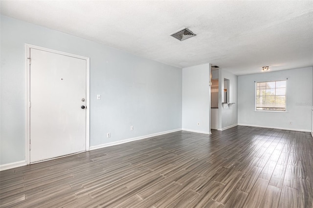 4507 9th St W Unit A2, Bradenton, FL 34207 - unfurnished room featuring dark wood finished floors and a textured ceiling