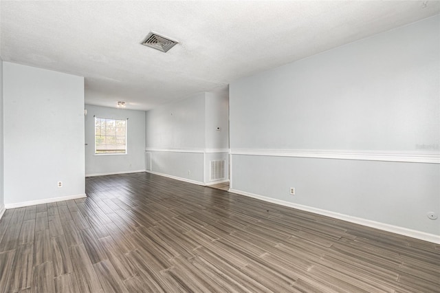 4507 9th St W Unit A2, Bradenton, FL 34207 - unfurnished room with wood finished floors and a textured ceiling