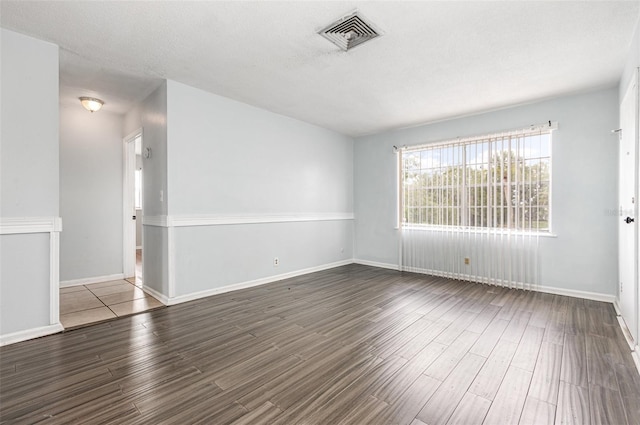 4507 9th St W Unit A2, Bradenton, FL 34207 - empty room with wood finished floors and baseboards