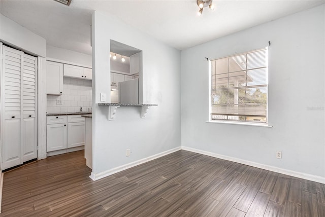 4507 9th St W Unit A2, Bradenton, FL 34207 - unfurnished dining area with dark wood finished floors and baseboards