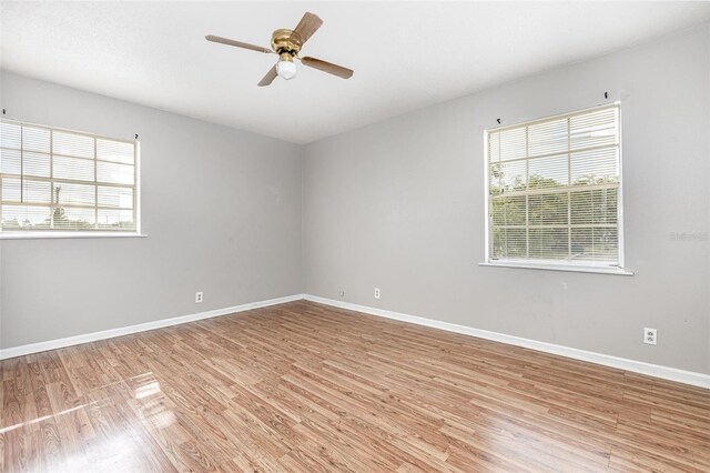 4507 9th St W Unit A2, Bradenton, FL 34207 - empty room featuring light wood-style flooring, healthy amount of natural light, and ceiling fan