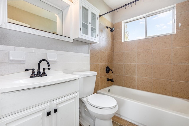 4507 9th St W Unit A2, Bradenton, FL 34207 - bathroom featuring tub / shower combination, vanity, and tile walls