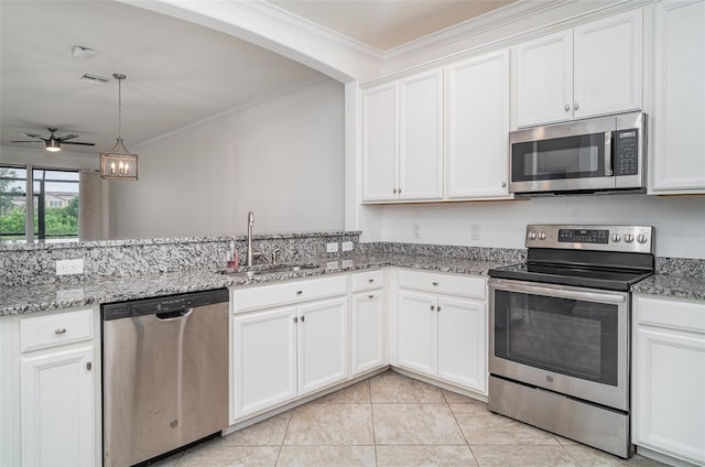 12515 Garibaldi Ln, Venice, FL 34293 - kitchen with appliances with stainless steel finishes, a sink, ornamental molding, a ceiling fan, and white cabinets