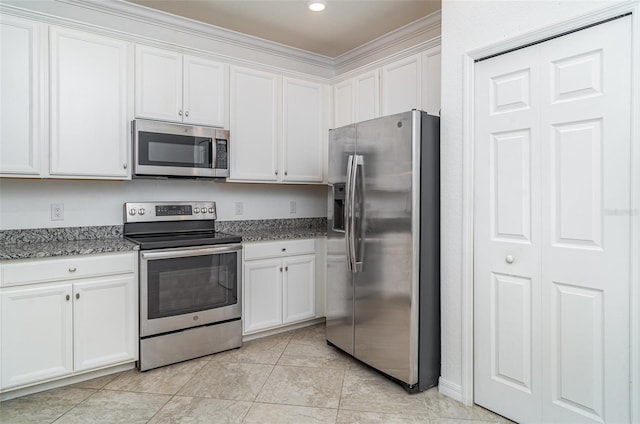 12515 Garibaldi Ln, Venice, FL 34293 - kitchen with appliances with stainless steel finishes, white cabinets, crown molding, stone countertops, and recessed lighting